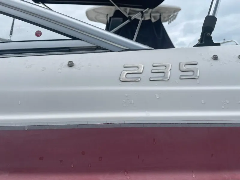 Slide: The Image of 2011 Bayliner 235 Bowrider boat detail with visible model number. - 22