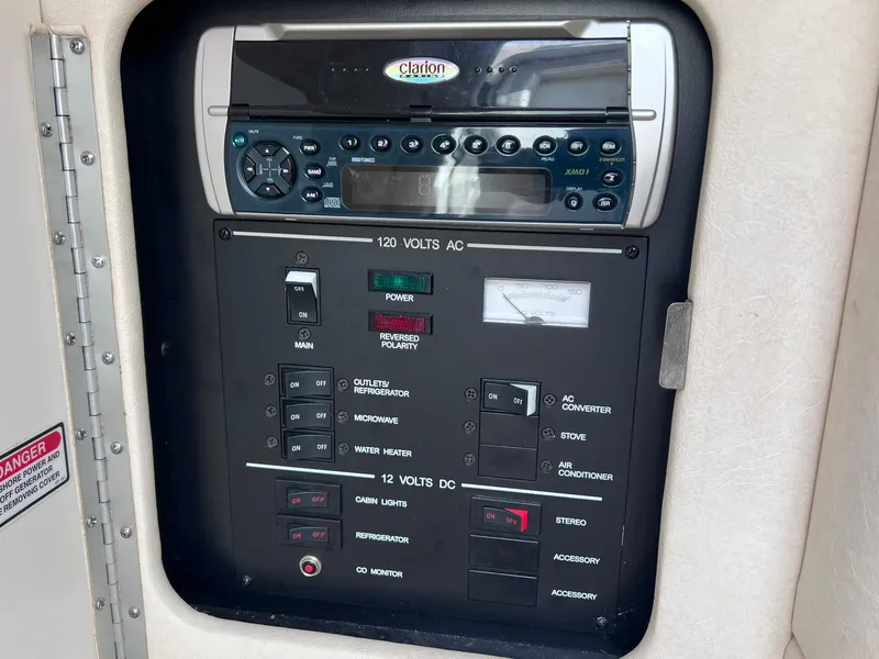 Slide: The Image of Control panel of a 2001 Sea Ray 260 Sundancer with Clarion stereo system. - 26