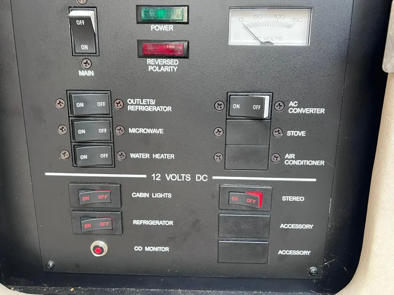 Slide: The Image of Electrical control panel of a 2001 Sea Ray 260 Sundancer boat. - 28