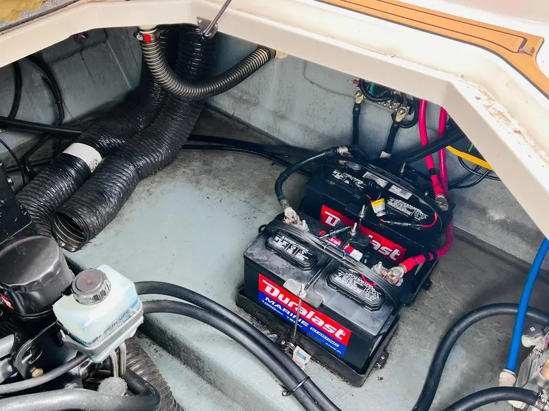 Slide: The Image of Engine compartment of 2001 Sea Ray 260 Sundancer with Duralast batteries. - 31