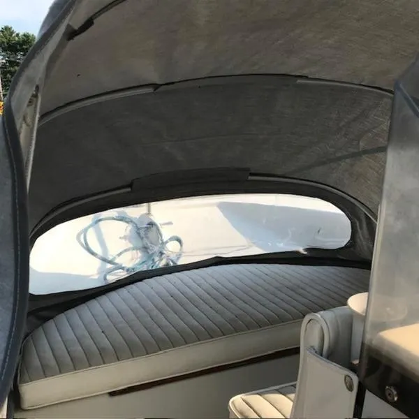 Slide: The Image of Interior view of a 1988 Boston Whaler 170 Montauk boat with canopy. - 6