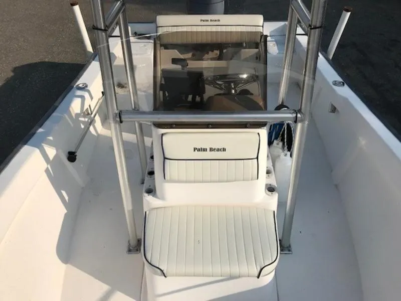 Slide: The Image of 2005 Palm Beach 1801 CC boat interior with white seating and console. - 10