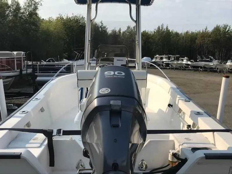 Slide: The Image of 2005 Palm Beach 1801 CC boat with 90 HP engine, docked outdoors. - 11