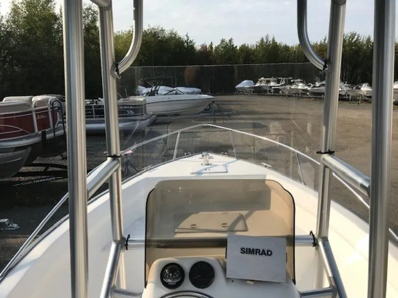Slide: The Image of 2005 Palm Beach 1801 CC boat with Simrad navigation, docked in a marina. - 4