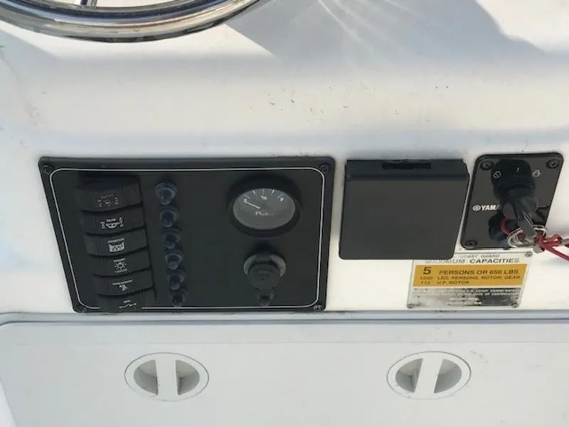 Slide: The Image of Control panel of 2005 Palm Beach 1801 CC boat with switches and gauges. - 5
