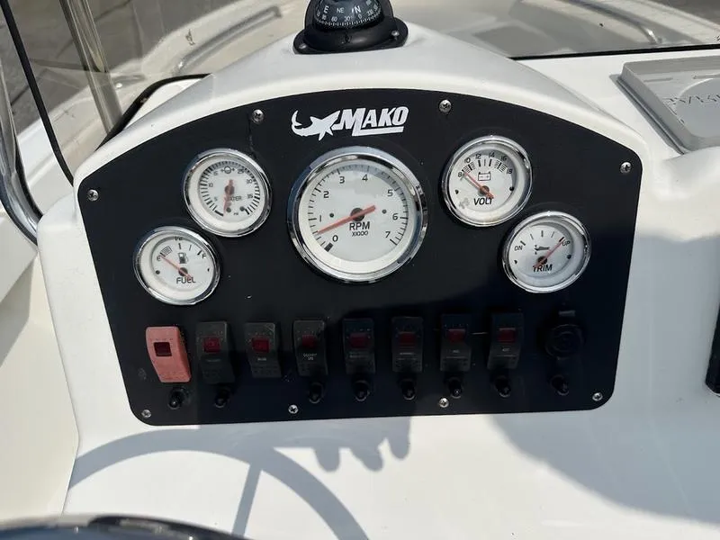 Slide: The Image of Dashboard of a 2019 Mako 180 CC boat with gauges and switches. - 10