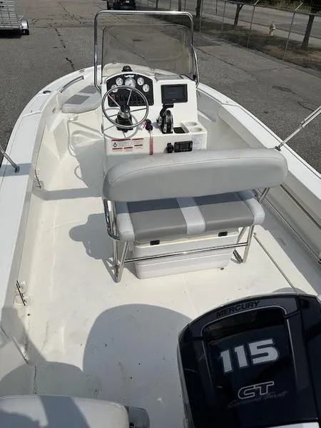 Slide: The Image of 2019 Mako 180 CC boat with Mercury 115 engine, featuring a central console and seating. - 11