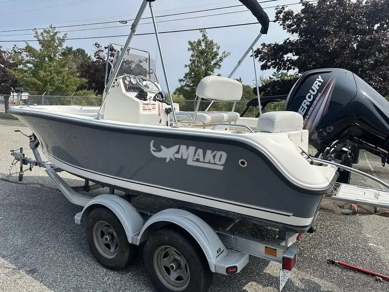 Slide: The Image of 2019 Mako 180 CC boat on trailer with Mercury outboard motor. - 4