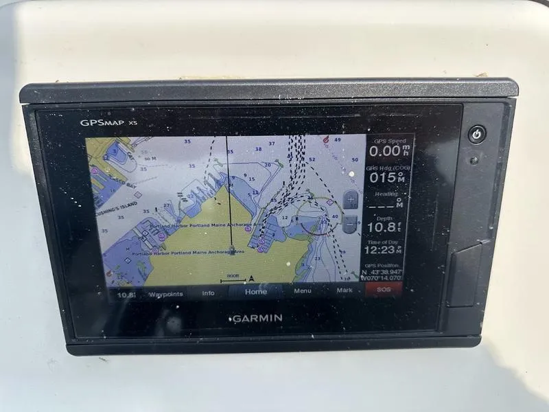 Slide: The Image of Garmin GPSMAP X5 on 2019 Mako 180 CC boat displaying nautical chart. - 6