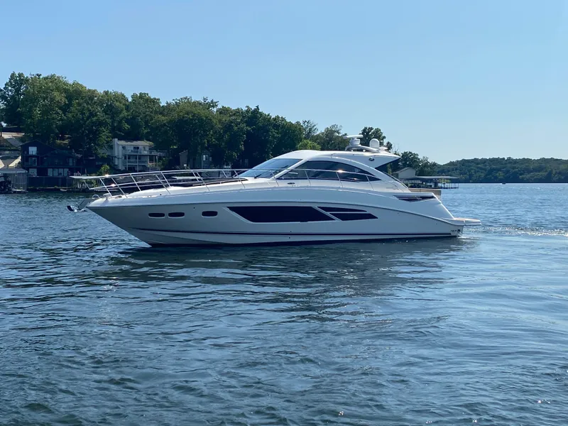 The Image of 2015 Sea Ray 510 Sundancer yacht cruising on a serene lake. - 0