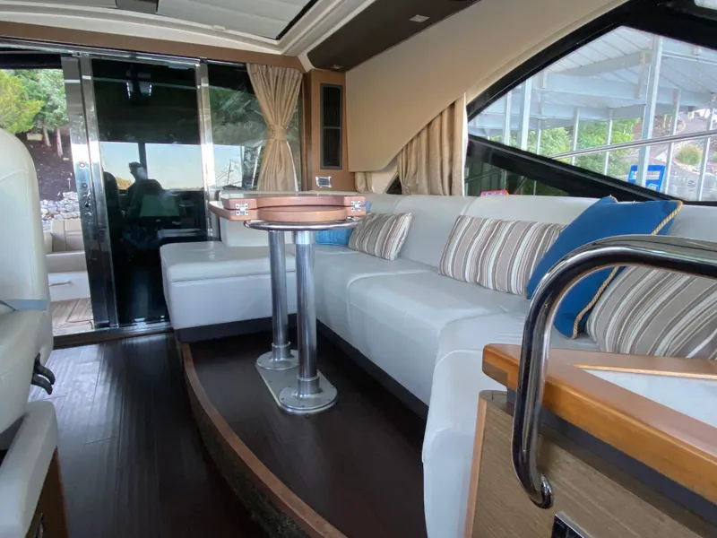 Slide: The Image of Luxurious interior of 2015 Sea Ray 510 Sundancer yacht with elegant seating and table. - 27