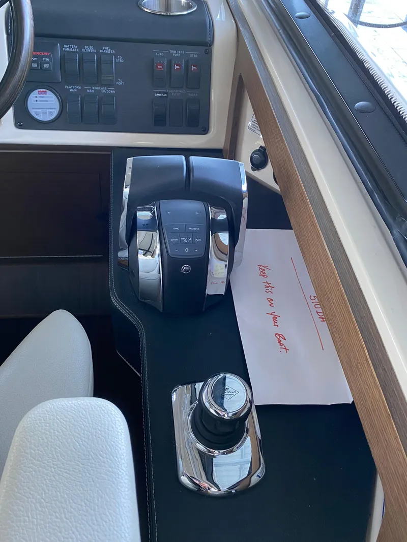 Slide: The Image of 2015 Sea Ray 510 Sundancer helm controls and dashboard. - 33