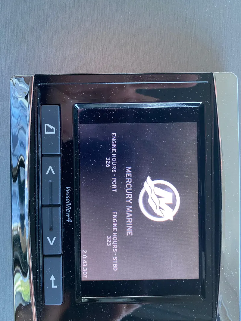 Slide: The Image of Mercury Marine display on 2015 Sea Ray 510 Sundancer showing engine hours. - 34