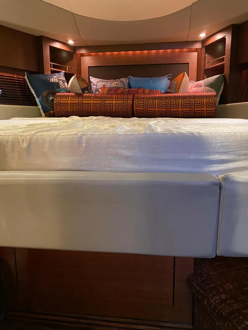 Slide: The Image of Luxurious 2015 Sea Ray 510 Sundancer cabin interior with plush bedding. - 39