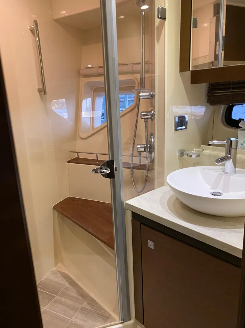 Slide: The Image of Luxurious bathroom in 2015 Sea Ray 510 Sundancer yacht with modern fixtures and shower. - 40