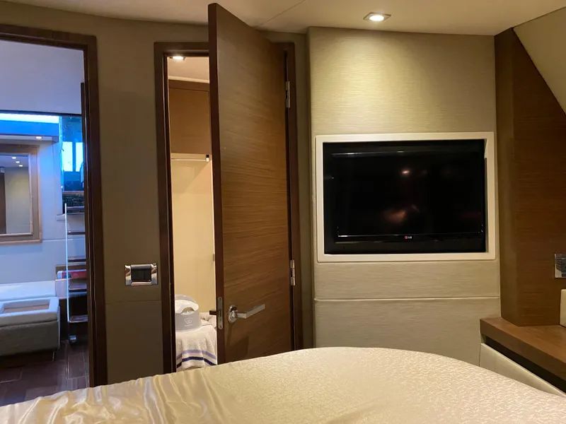 Slide: The Image of Luxurious interior of 2015 Sea Ray 510 Sundancer yacht with TV and open door. - 45