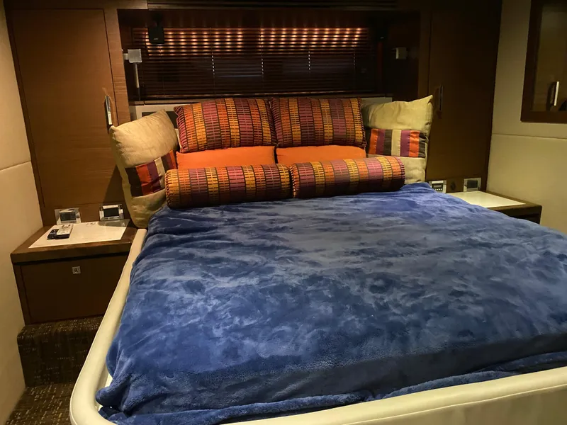 Slide: The Image of Luxurious bedroom interior of 2015 Sea Ray 510 Sundancer yacht with plush bedding. - 46