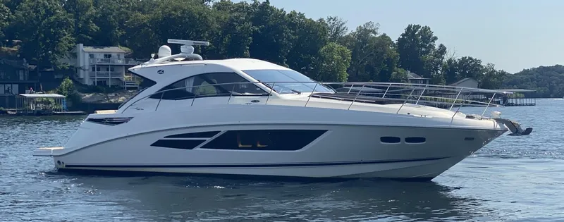 Slide: The Image of 2015 Sea Ray 510 Sundancer yacht on a serene lake. - 5