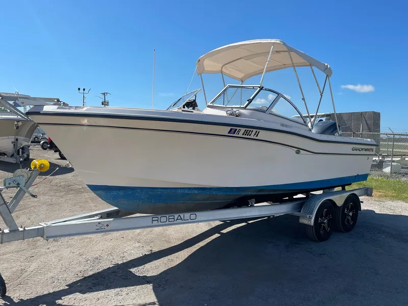 The Image of 2008 Grady-White Tournament 205 boat on Robalo trailer, parked outdoors. - 0