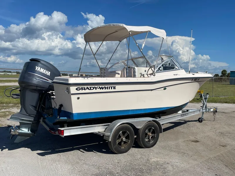 Slide: The Image of 2008 Grady-White Tournament 205 boat on trailer with Yamaha outboard motor. - 2