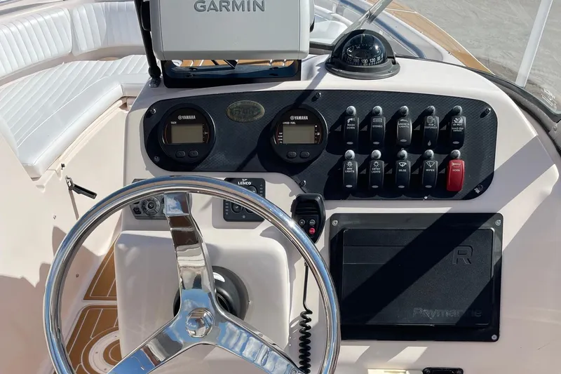 Slide: The Image of 2008 Grady-White Tournament 205 dashboard with Garmin GPS and steering wheel. - 5