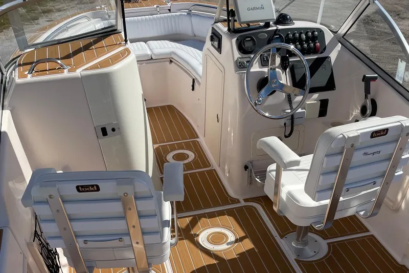Slide: The Image of 2008 Grady-White Tournament 205 boat interior with seating and steering console. - 6