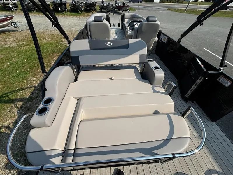 Slide: The Image of 2023 Princecraft QUORUM Q25 pontoon boat with spacious seating and cup holders. - 11