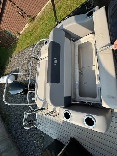 Slide: The Image of 2023 Princecraft QUORUM Q25 boat with open storage compartment on deck. - 5