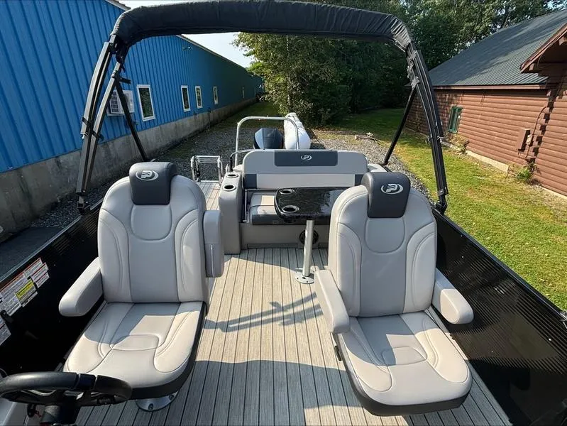 Slide: The Image of 2023 Princecraft QUORUM Q25 boat interior with plush seating and sleek design. - 7