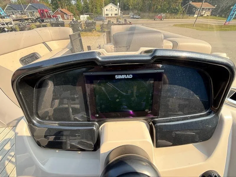 Slide: The Image of 2023 Princecraft QUORUM Q25 boat dashboard with Simrad navigation system. - 9