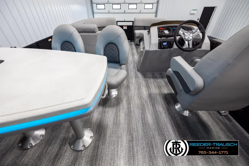 Slide: The Image of Interior of 2025 Bennington 23 SXPDSE pontoon boat with modern seating and steering console. - 17