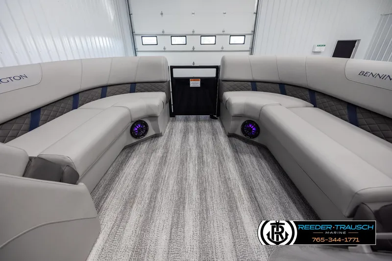 Slide: The Image of Interior of 2025 Bennington 23 SXPDSE pontoon boat with luxurious seating and modern design. - 18
