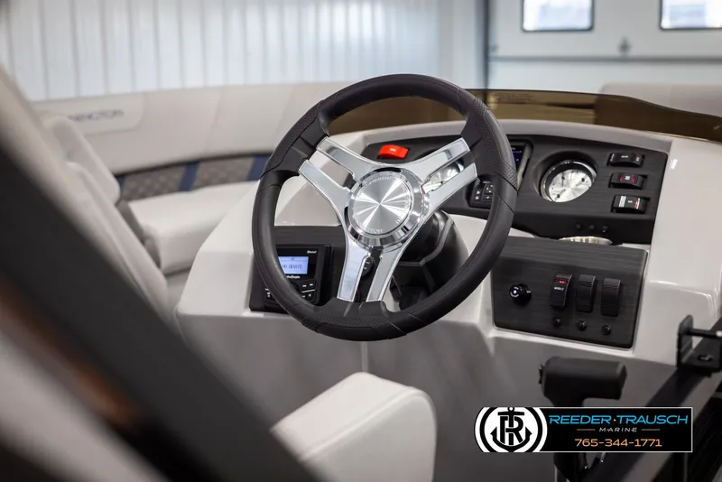 Slide: The Image of Interior view of 2025 Bennington 23 SXPDSE boat dashboard and steering wheel. - 26