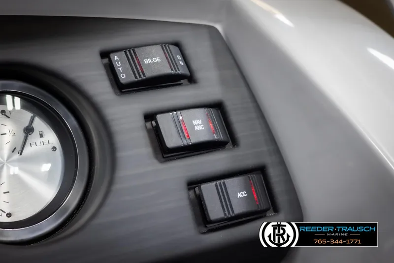 Slide: The Image of Dashboard controls of 2025 Bennington 23 SXPDSE boat with fuel gauge and switches. - 34