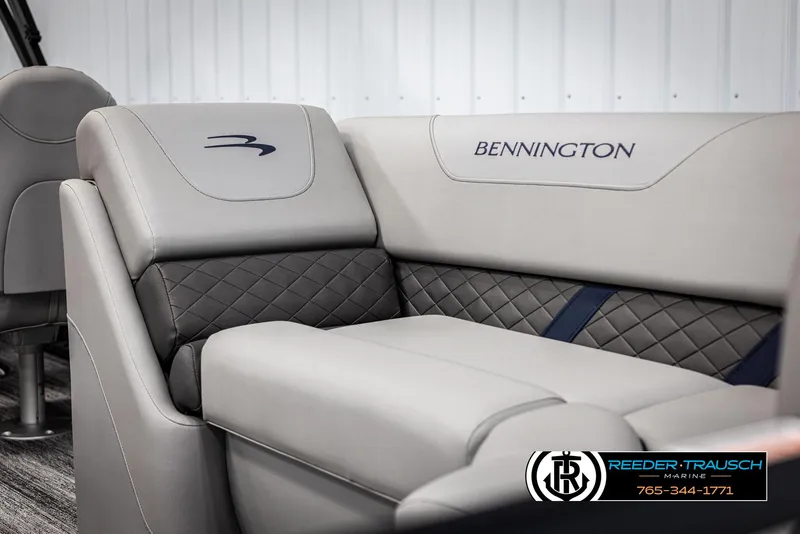 Slide: The Image of 2025 Bennington 23 SXPDSE boat interior with luxurious seating and quilted design. - 40