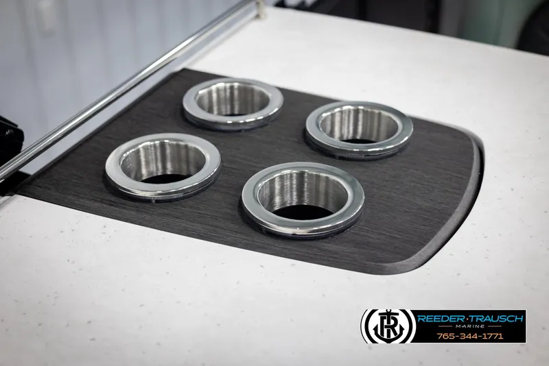 Slide: The Image of Cup holders on a 2025 Bennington 23 SXPDSE boat, featuring sleek chrome accents. - 43