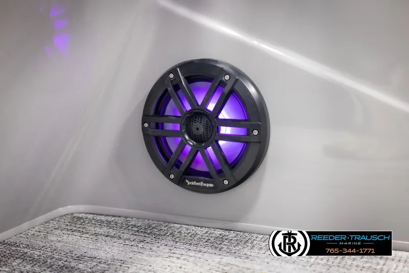 Slide: The Image of Illuminated speaker on 2025 Bennington 23 SXPDSE boat interior, featuring purple LED lighting. - 46