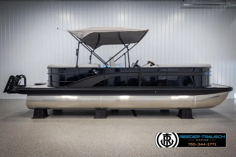 Slide: The Image of 2025 Bennington 23 SXPDSE pontoon boat with canopy in showroom. - 5