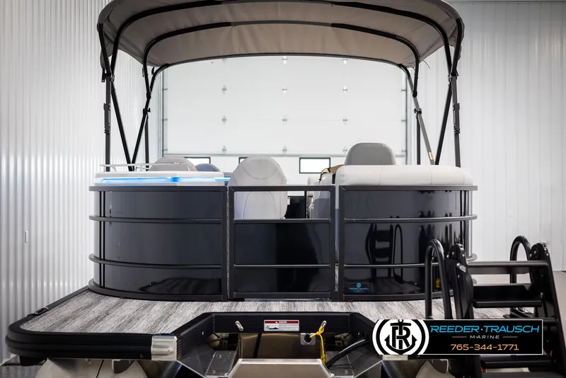 Slide: The Image of 2025 Bennington 23 SXPDSE pontoon boat with canopy in showroom. - 7