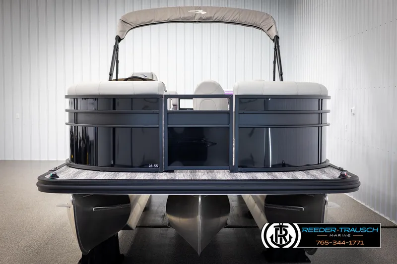 Slide: The Image of 2025 Bennington 23 SXPDSE pontoon boat in showroom, front view. - 8