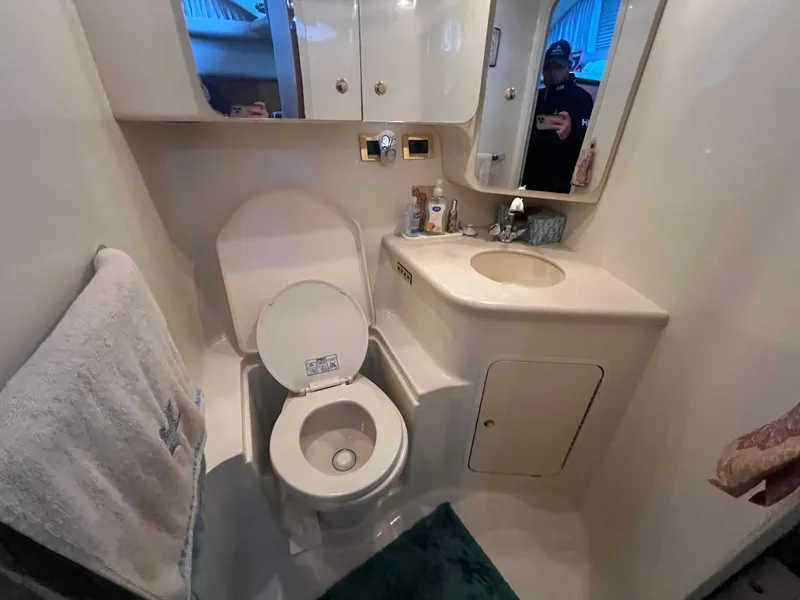 Slide: The Image of Bathroom interior of 2000 Sea Ray 380 Aft Cabin yacht, featuring toilet and sink. - 23