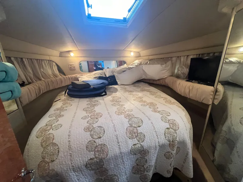 Slide: The Image of Cozy bedroom in 2000 Sea Ray 380 Aft Cabin yacht with quilted bedding. - 24