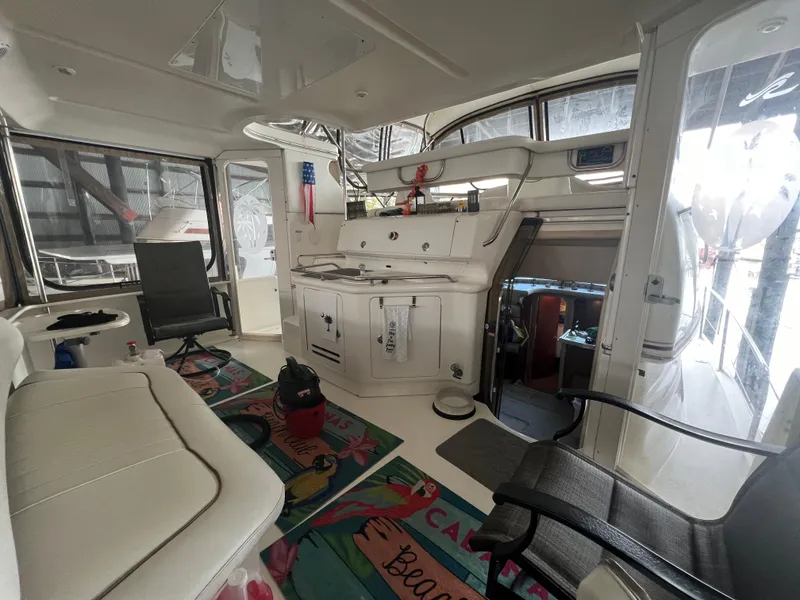Slide: The Image of Interior of 2000 Sea Ray 380 Aft Cabin yacht, featuring seating and decor. - 4