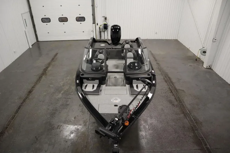 Slide: The Image of 2025 Crestliner 1850 Super Hawk JS boat in a garage setting. - 10