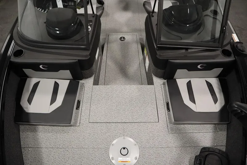 Slide: The Image of 2025 Crestliner 1850 Super Hawk JS interior with dual consoles and seating. - 18