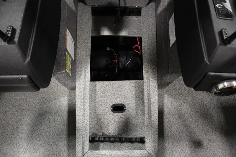 Slide: The Image of 2025 Crestliner 1850 Super Hawk JS interior with open storage compartment. - 20