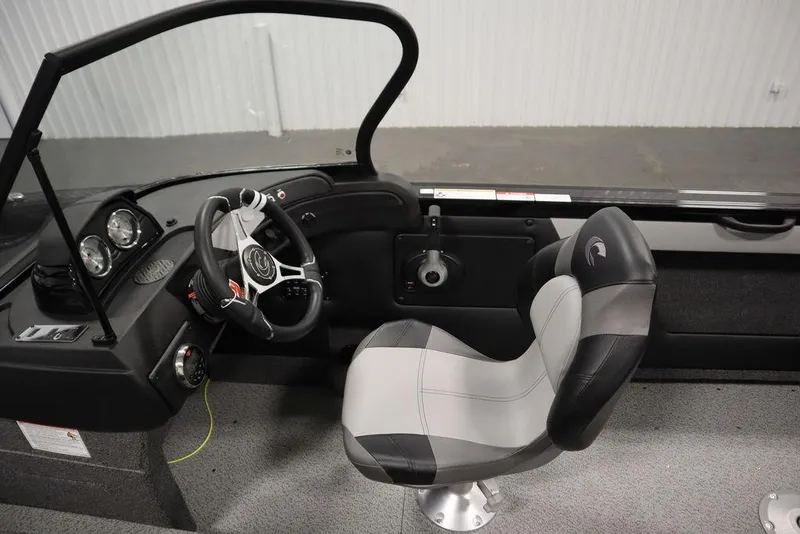 Slide: The Image of 2025 Crestliner 1850 Super Hawk JS boat interior with steering wheel and seat. - 21