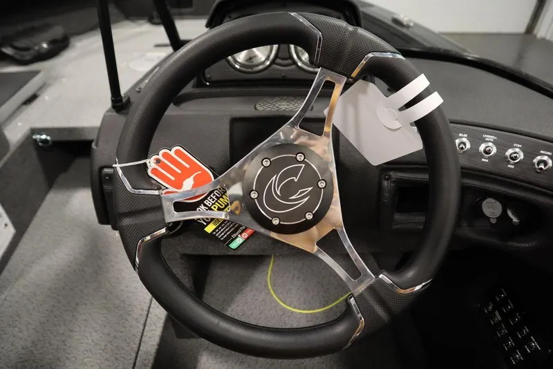 Slide: The Image of 2025 Crestliner 1850 Super Hawk JS steering wheel with modern design and controls. - 24