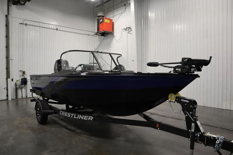 Slide: The Image of 2025 Crestliner 1850 Super Hawk JS boat in a garage setting. - 3