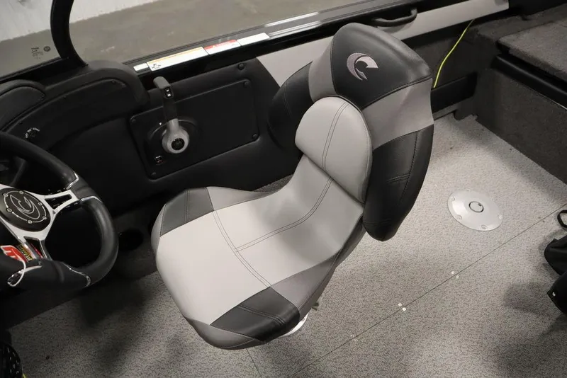 Slide: The Image of 2025 Crestliner 1850 Super Hawk JS boat interior with gray and black captain's chair. - 30